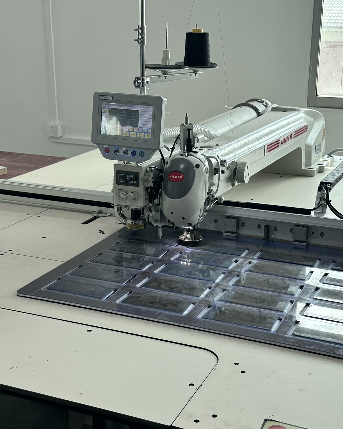 Suit measurement and construction review at a production station